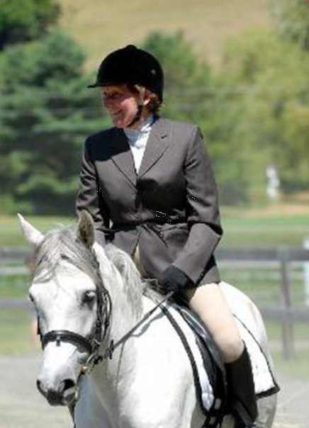 Horse and rider in grey coat